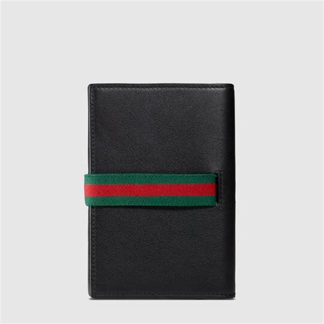 gucci passport holder men's|gucci men's tiger wallet.